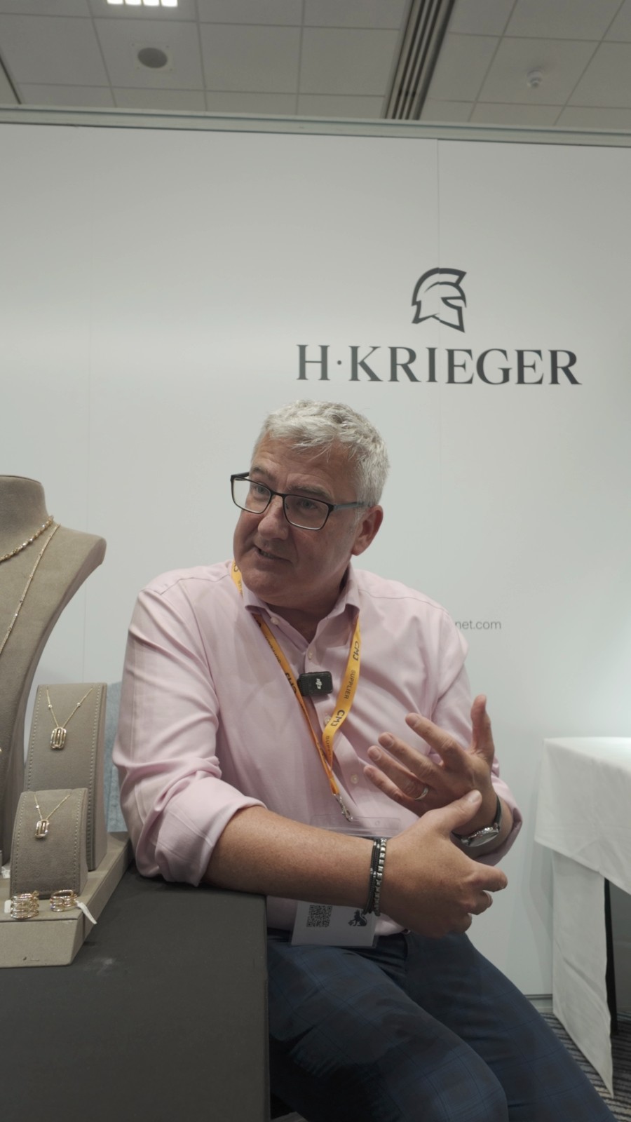 David Fell speaking at the Hans D. Krieger stand during his HIKOMORE interview at CMJ